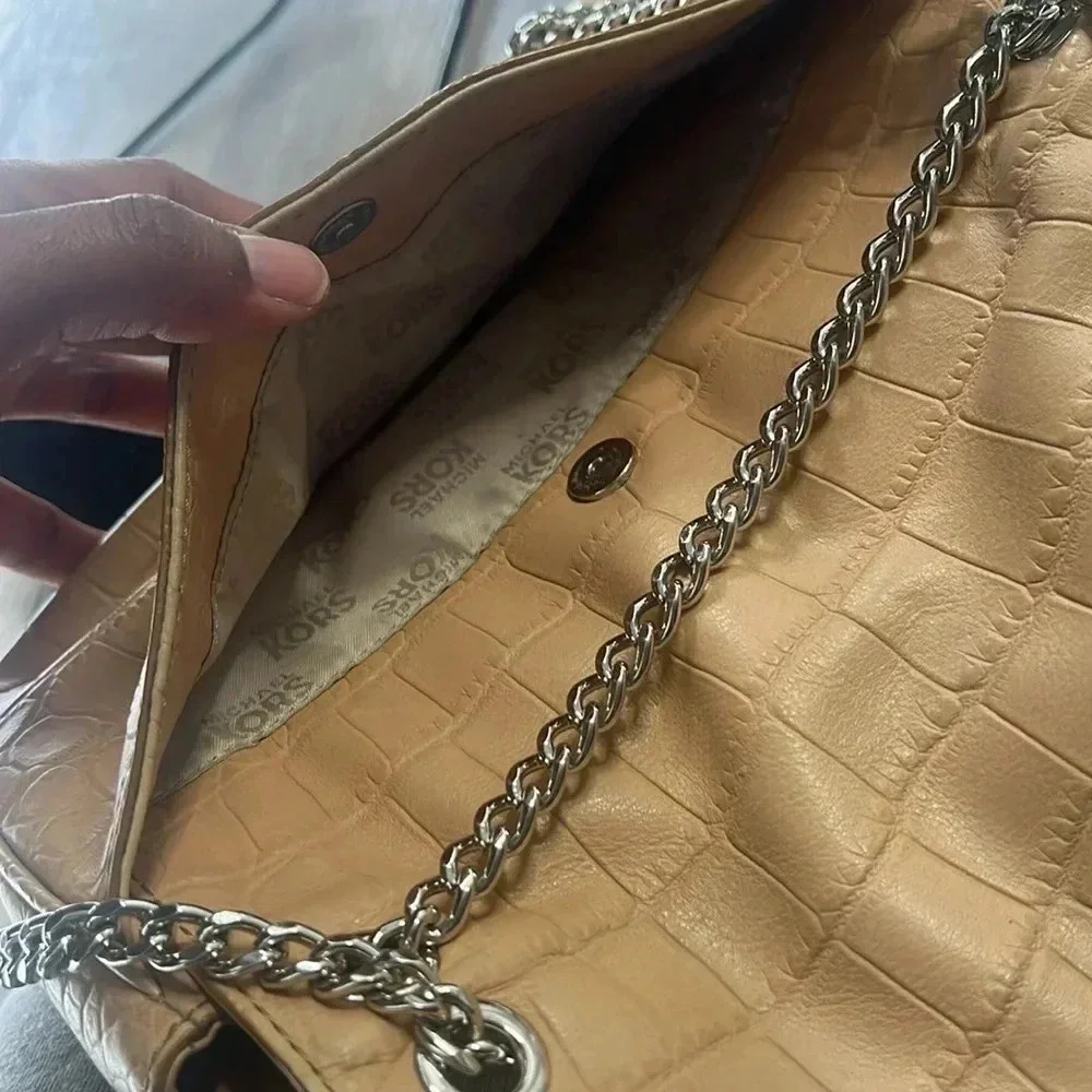 Tan Michael Kors envelope chain crossbody purse with adjustable straps